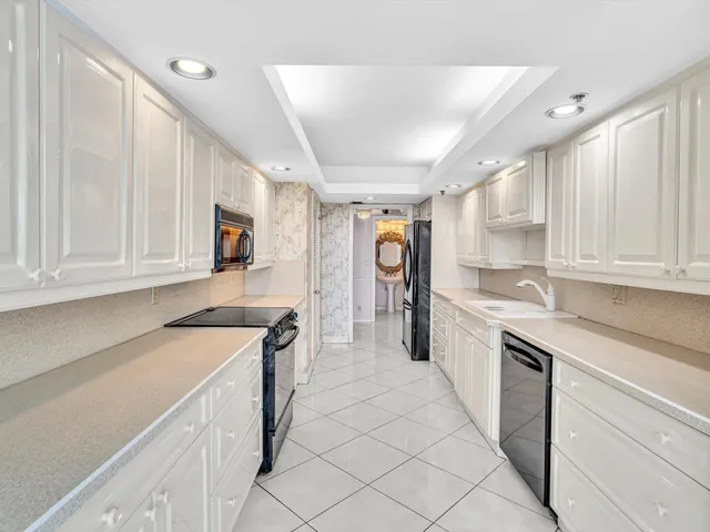 a spacious bedroom with a large bed and a large window