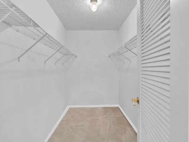 a living room with lots of furniture and a chandelier