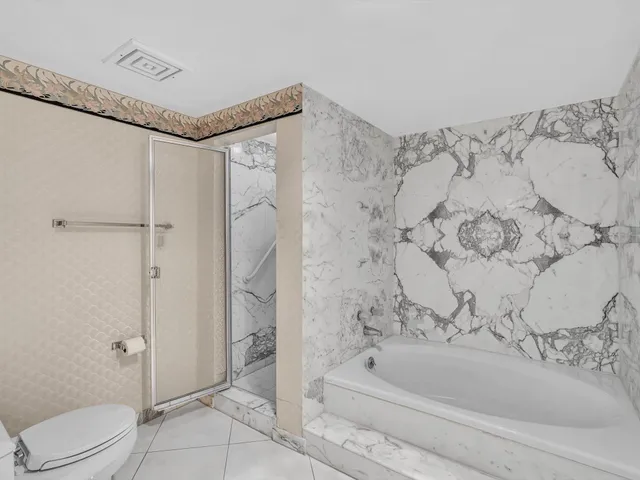 a view of living room with furniture and floor to ceiling window