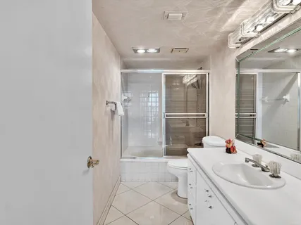 a living room with furniture a flat screen tv and a window