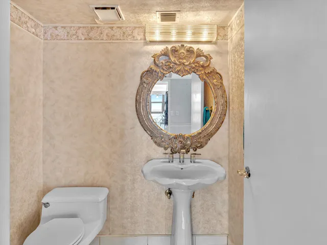 an aerial view of residential building and ocean view