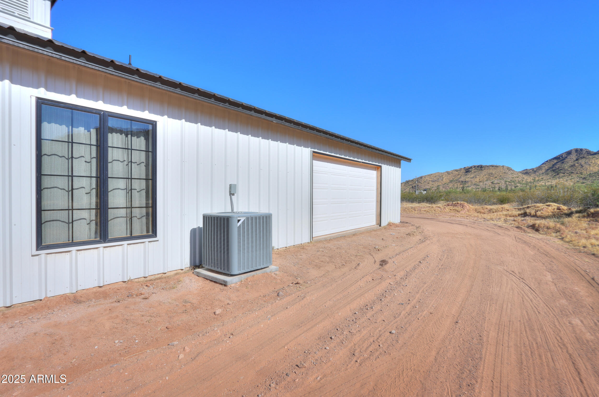 55091 West Pima Road Maricopa, AZ 85139 - Photo 41 of 43 Passthrough garage