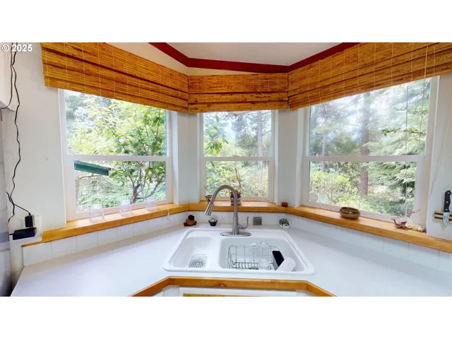 a bathroom with a large window and a sink