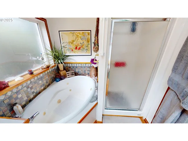 a bathroom with a tub and a sink