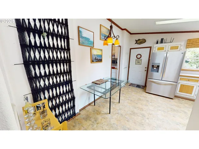 a living room with a couch and a dining table