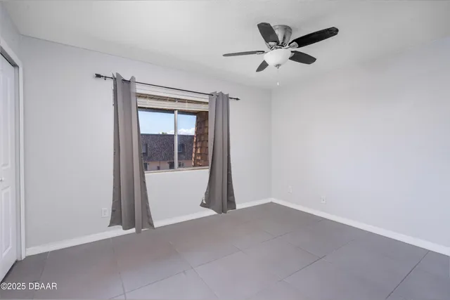 a view of livingroom with hardwood floor and a ceiling fan