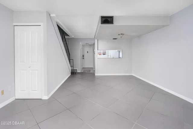 a view of a storage & utility room with a window
