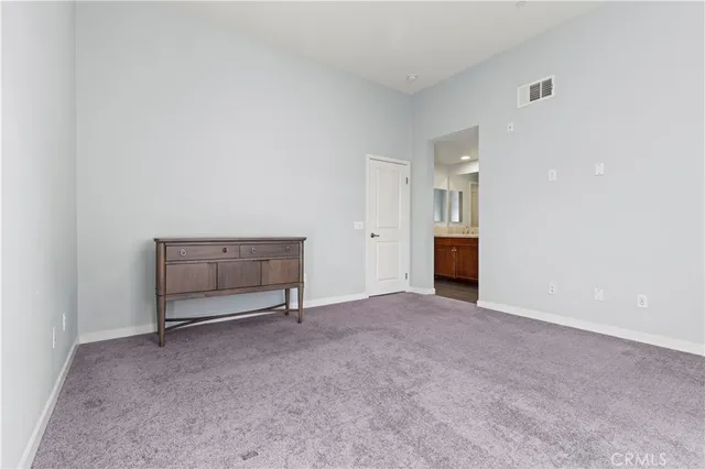 a bathroom with a double vanity sink and mirror
