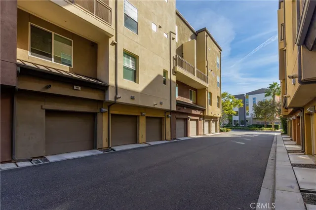 a aerial view of a house with a yard and lake view