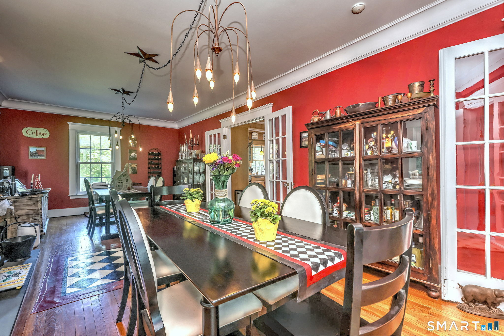 25 Center Road Woodbridge, CT 06525 - Photo 16 of 34 a dining room with furniture a chandelier and wooden floor
