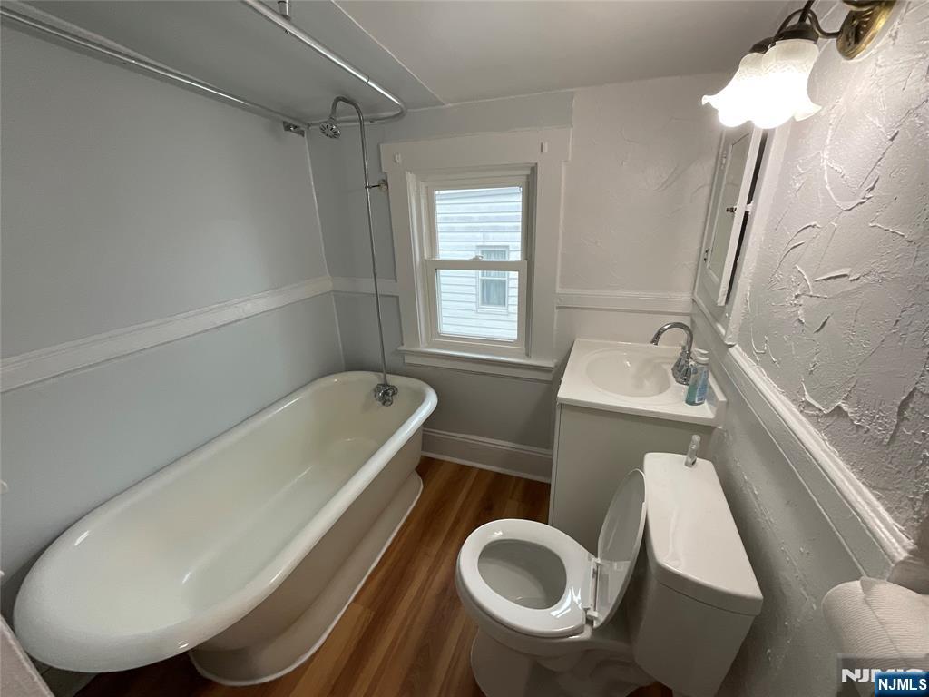 131 Delafield Avenue, Unit 3 Lyndhurst, NJ 07071 - Photo 10 of 15 a bathroom with a sink toilet and shower