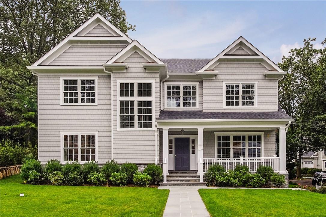 99 Sonn Drive Rye, NY 10580 - Photo 1 of 1 a front view of a house with garden