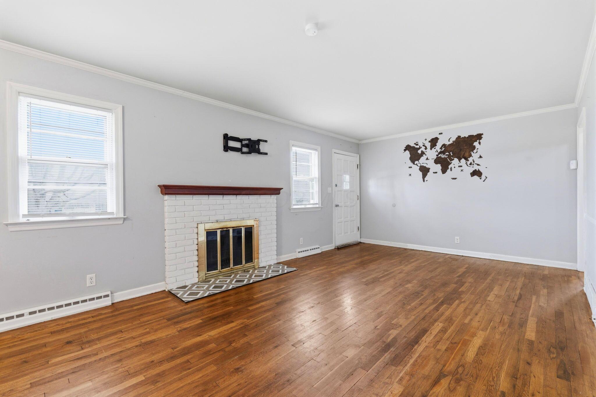 2846 Hampton Road South Columbus, OH 43232 - Photo 7 of 35 Step inside and you’ll find real hardwood floors, cozy fireplace vibes, and space that actually works for everyday living.