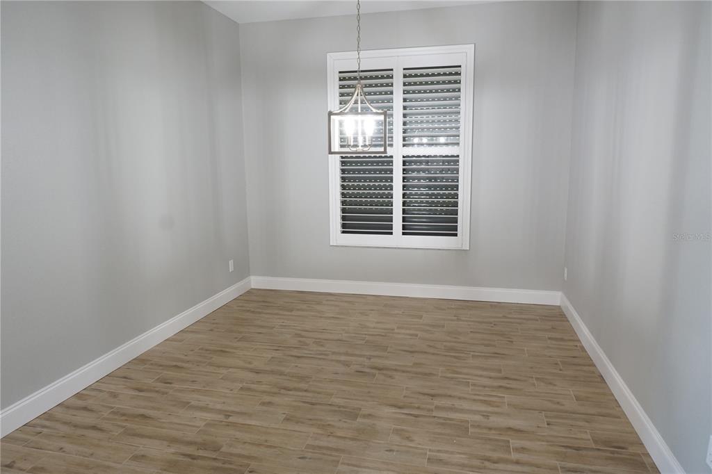 2000 Bal Harbor Boulevard, Unit 1012 Punta Gorda, FL 33950 - Photo 17 of 61 a view of an empty room with wooden floor and a window
