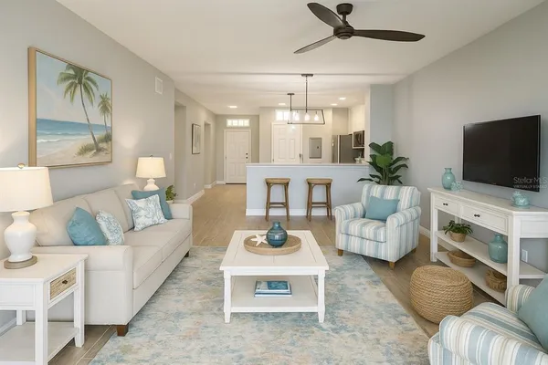 a view of a kitchen with wooden floor and a refrigerator