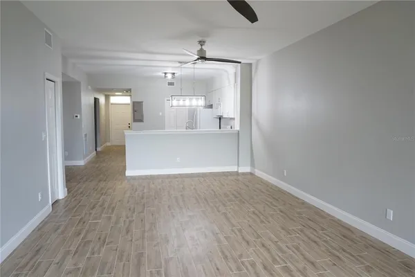 a bedroom with a bed and a night stand