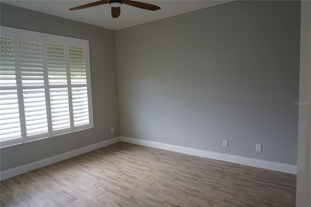2000 Bal Harbor Boulevard, Unit 1012 Punta Gorda, FL 33950 - Photo 21 of 61 an empty room with wooden floor and windows