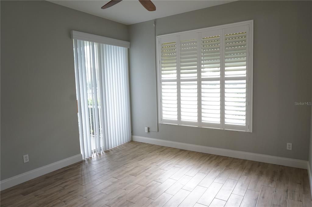 2000 Bal Harbor Boulevard, Unit 1012 Punta Gorda, FL 33950 - Photo 22 of 61 a view of an empty room with wooden floor and a window