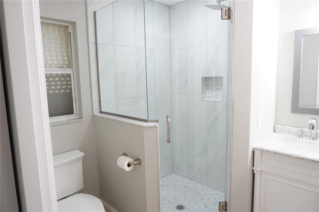 2000 Bal Harbor Boulevard, Unit 1012 Punta Gorda, FL 33950 - Photo 25 of 61 a bathroom with a shower and toilet