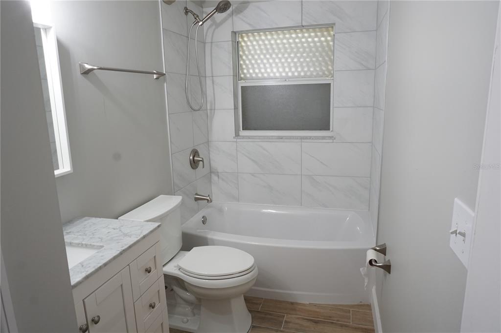 2000 Bal Harbor Boulevard, Unit 1012 Punta Gorda, FL 33950 - Photo 33 of 61 a bathroom with a toilet sink and shower