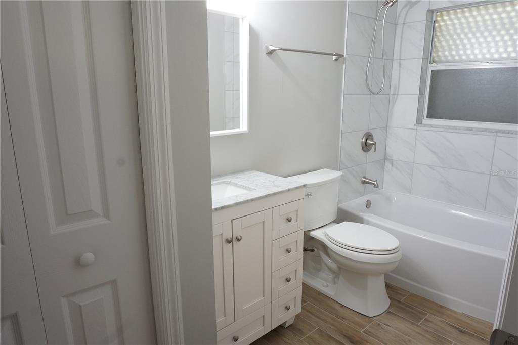 2000 Bal Harbor Boulevard, Unit 1012 Punta Gorda, FL 33950 - Photo 34 of 61 a bathroom with a sink toilet and shower