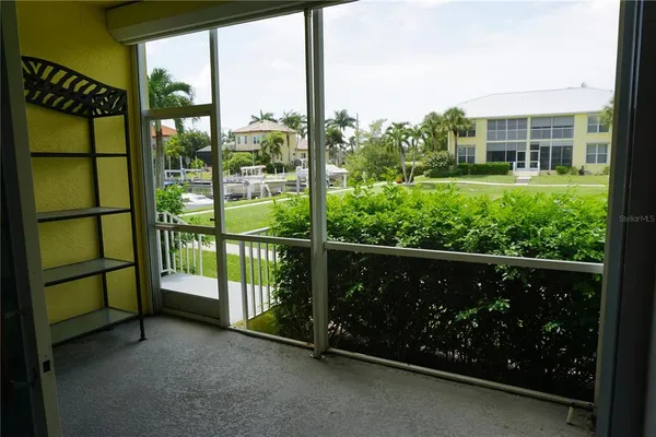 a view of a house with backyard porch and sitting area
