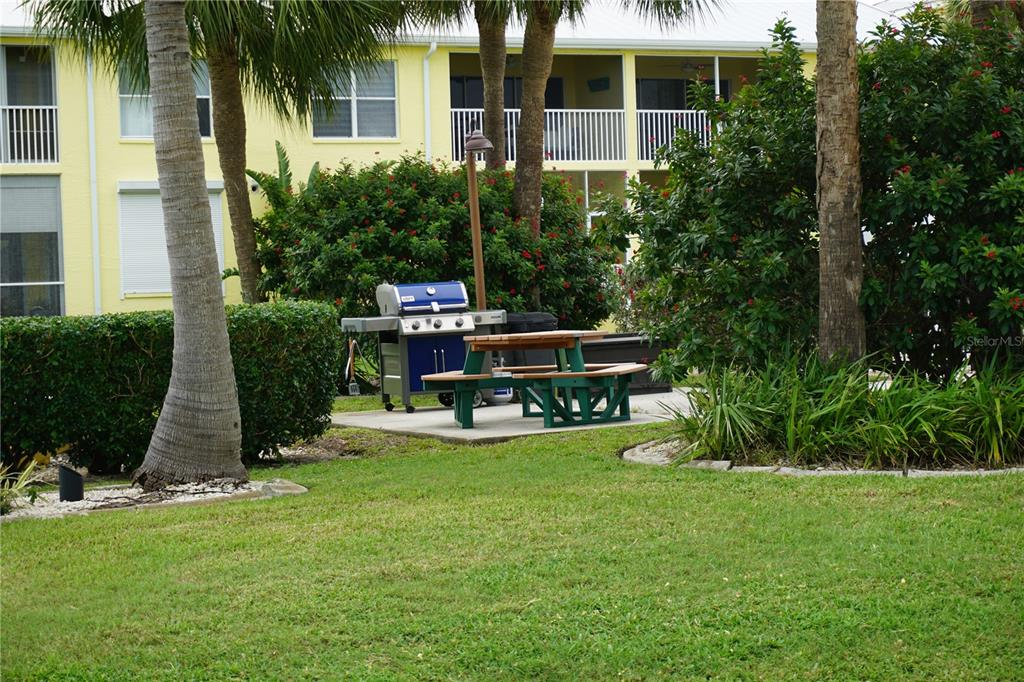 2000 Bal Harbor Boulevard, Unit 1012 Punta Gorda, FL 33950 - Photo 50 of 61 a view of a house with backyard porch and sitting area