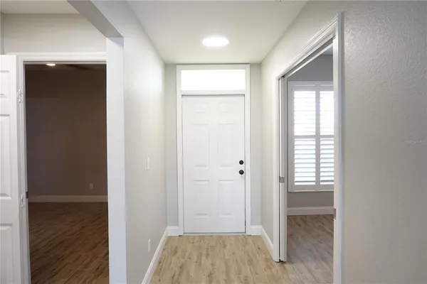 a view of room with window and hardwood floor