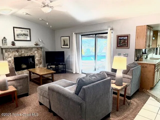a living room with furniture a couch and a flat screen tv