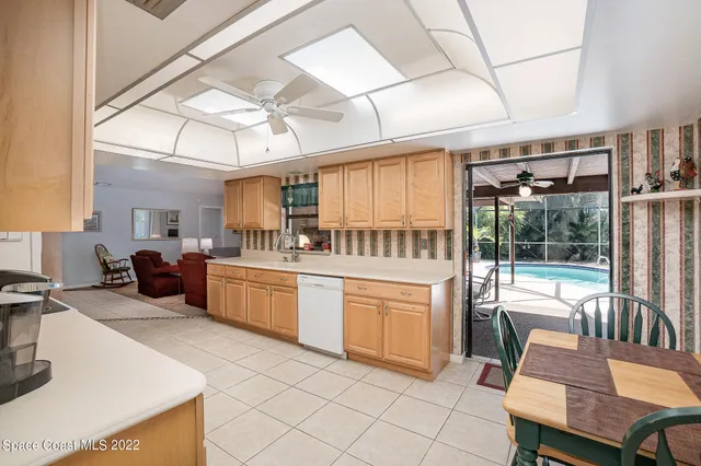 a kitchen with sink cabinets and outdoor space