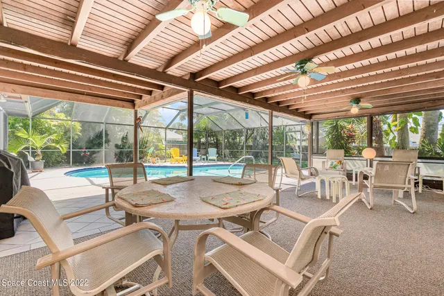 a view of a swimming pool with a yard