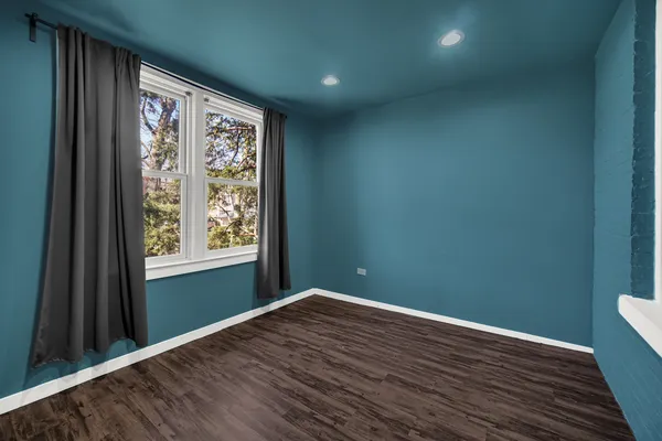 a kitchen with stainless steel appliances granite countertop a stove a sink dishwasher a refrigerator and cabinets with wooden floor