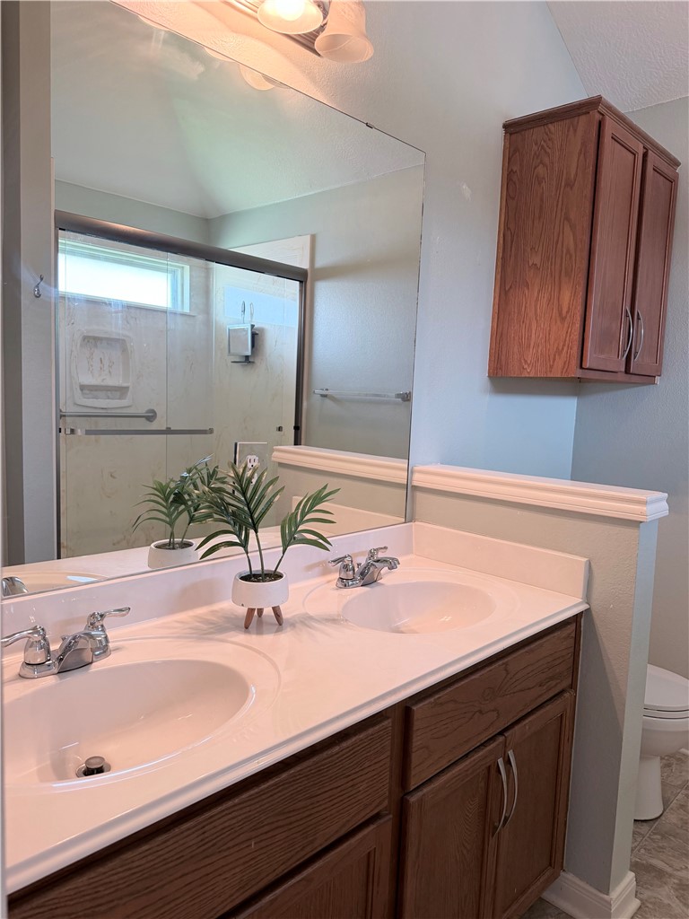 1029 Fallbrook Loop College Station, TX 77845 - Photo 17 of 34 a bathroom with a sink and a mirror