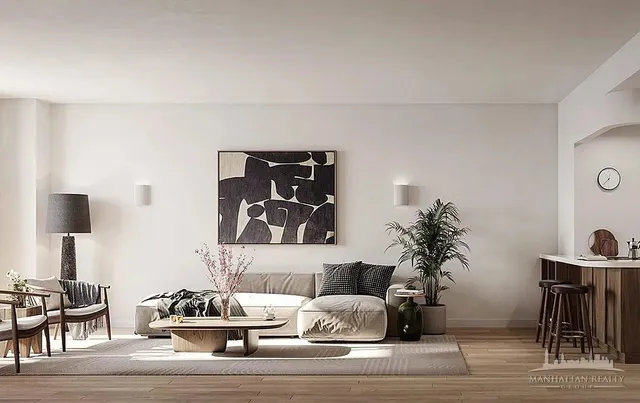 a living room with furniture and a potted plant