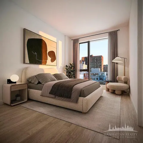 a bedroom with a bed and a couch