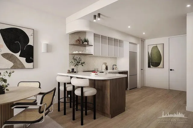a kitchen with a sink cabinets and appliances