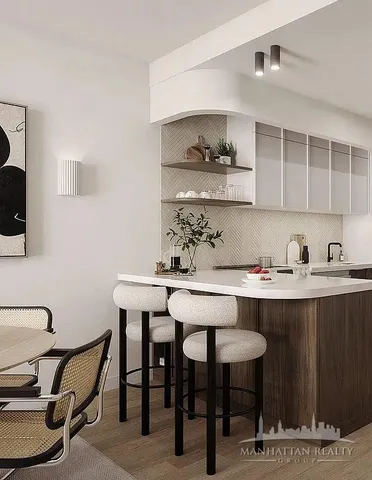 a kitchen with a table and chairs in it