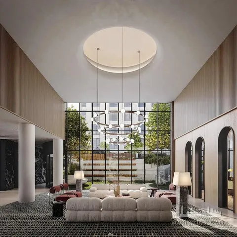 a living room with furniture and a floor to ceiling window