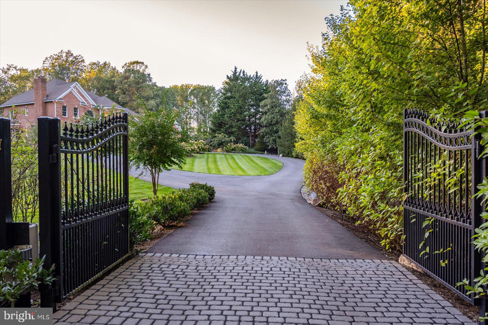 17 Perder Lane Edgewater, MD 21037 - Photo 4 of 115 Grand gated paver entrance to circular driveway