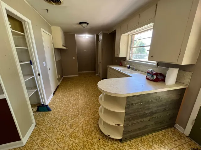 a room with a table and chairs