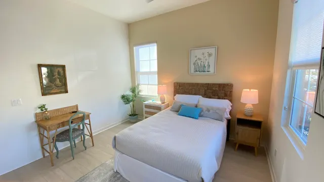 a bedroom with a bed and a chair in it