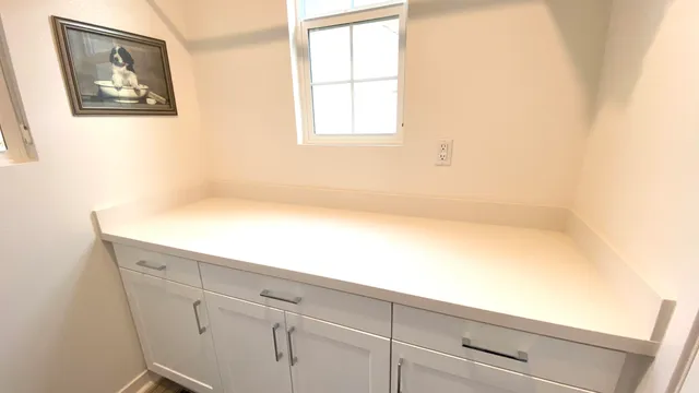 a bathroom with a bathtub and a window