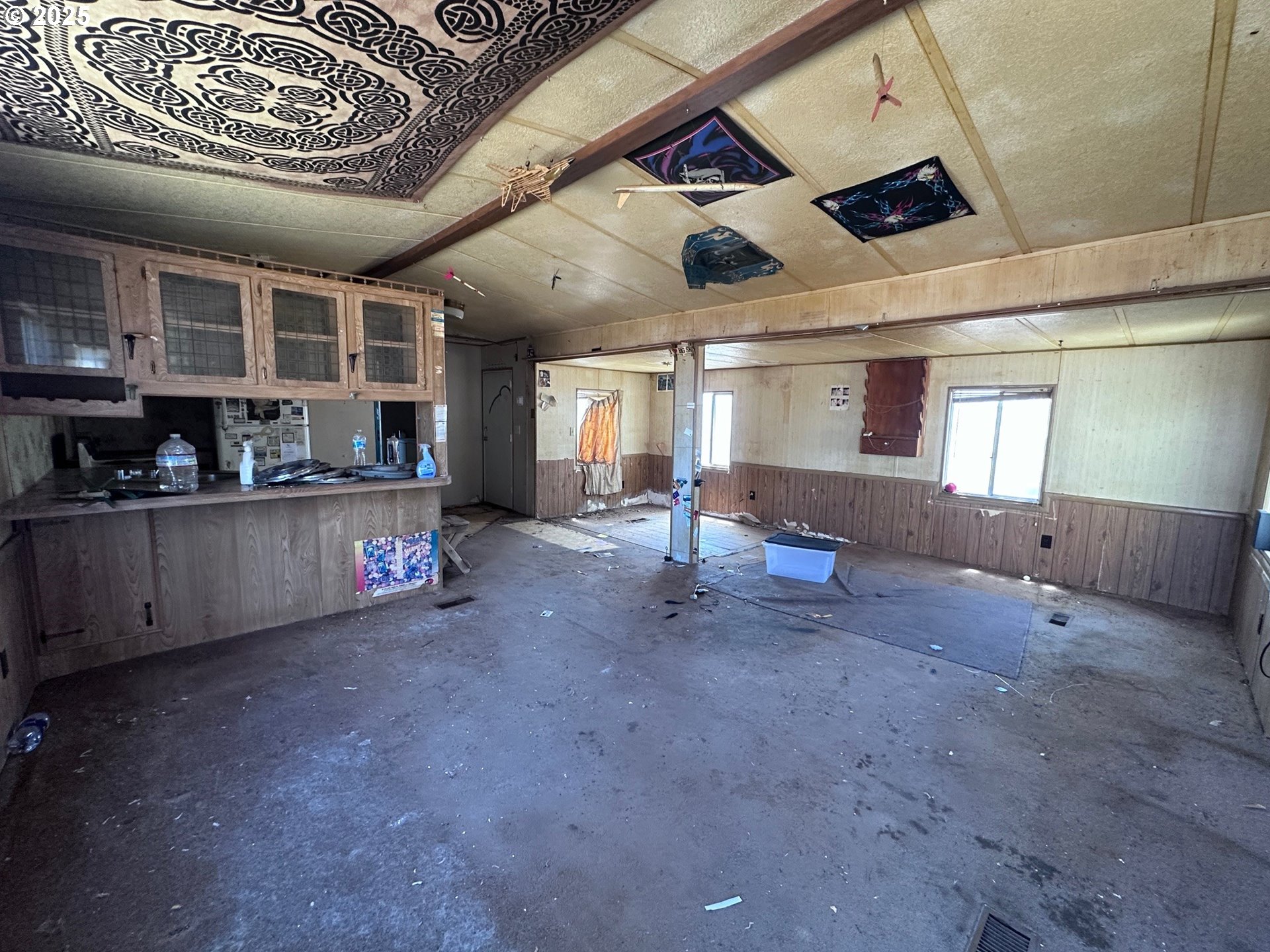 3295 Northeast 37th Street Redmond, OR 97756 - Photo 6 of 6 a large hall with the bricks wall and laminate vinyl floor