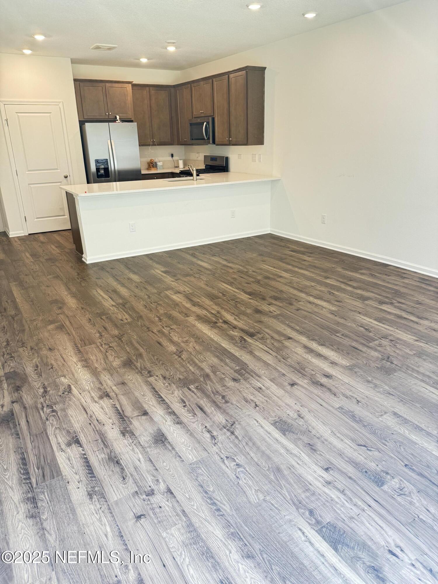 13505 Ute Jacksonville, FL 32218 - Photo 14 of 34 a view of kitchen with stainless steel appliances refrigerator and microwave
