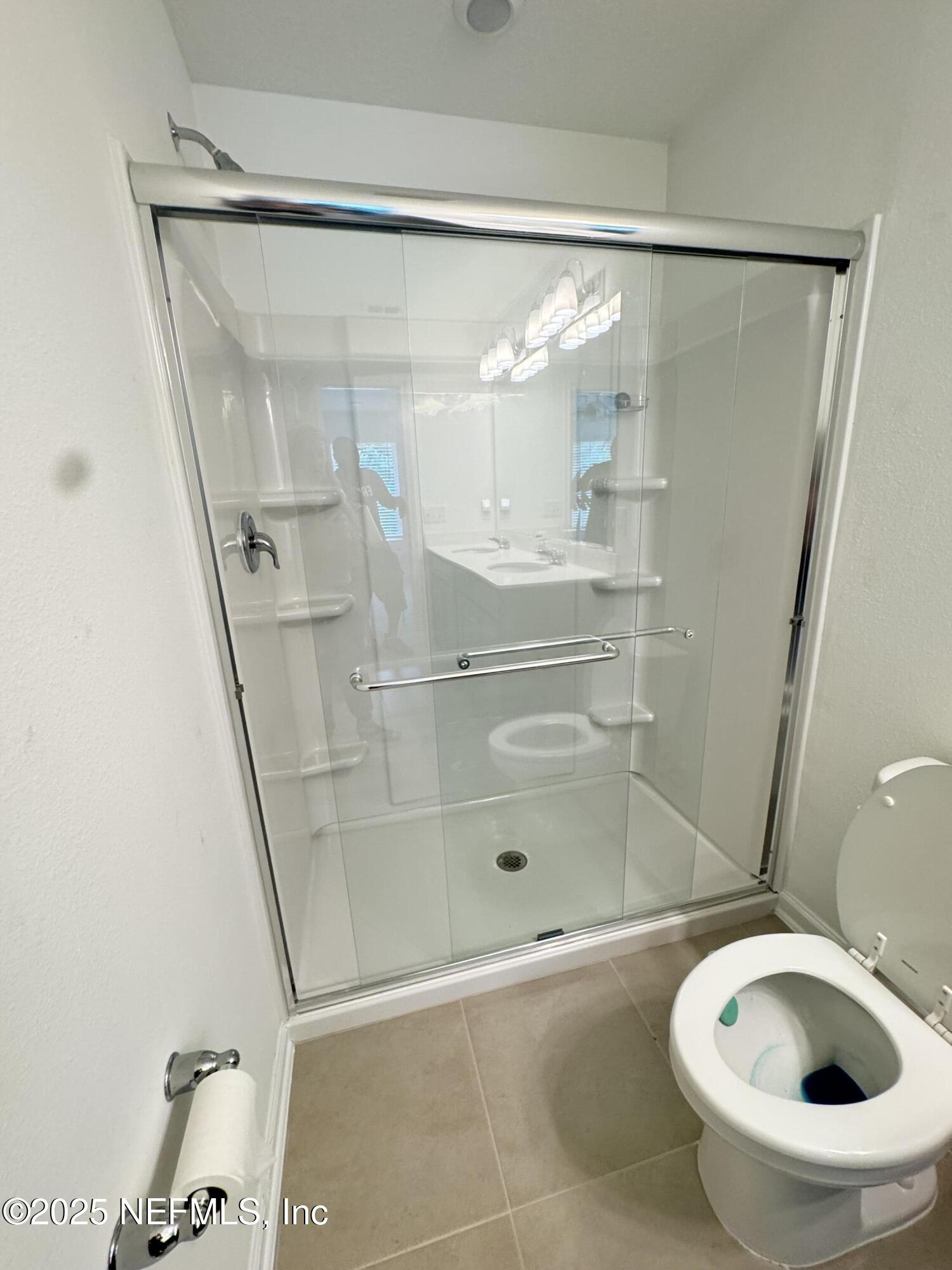 13505 Ute Jacksonville, FL 32218 - Photo 22 of 34 a bathroom with a shower a toilet and a sink