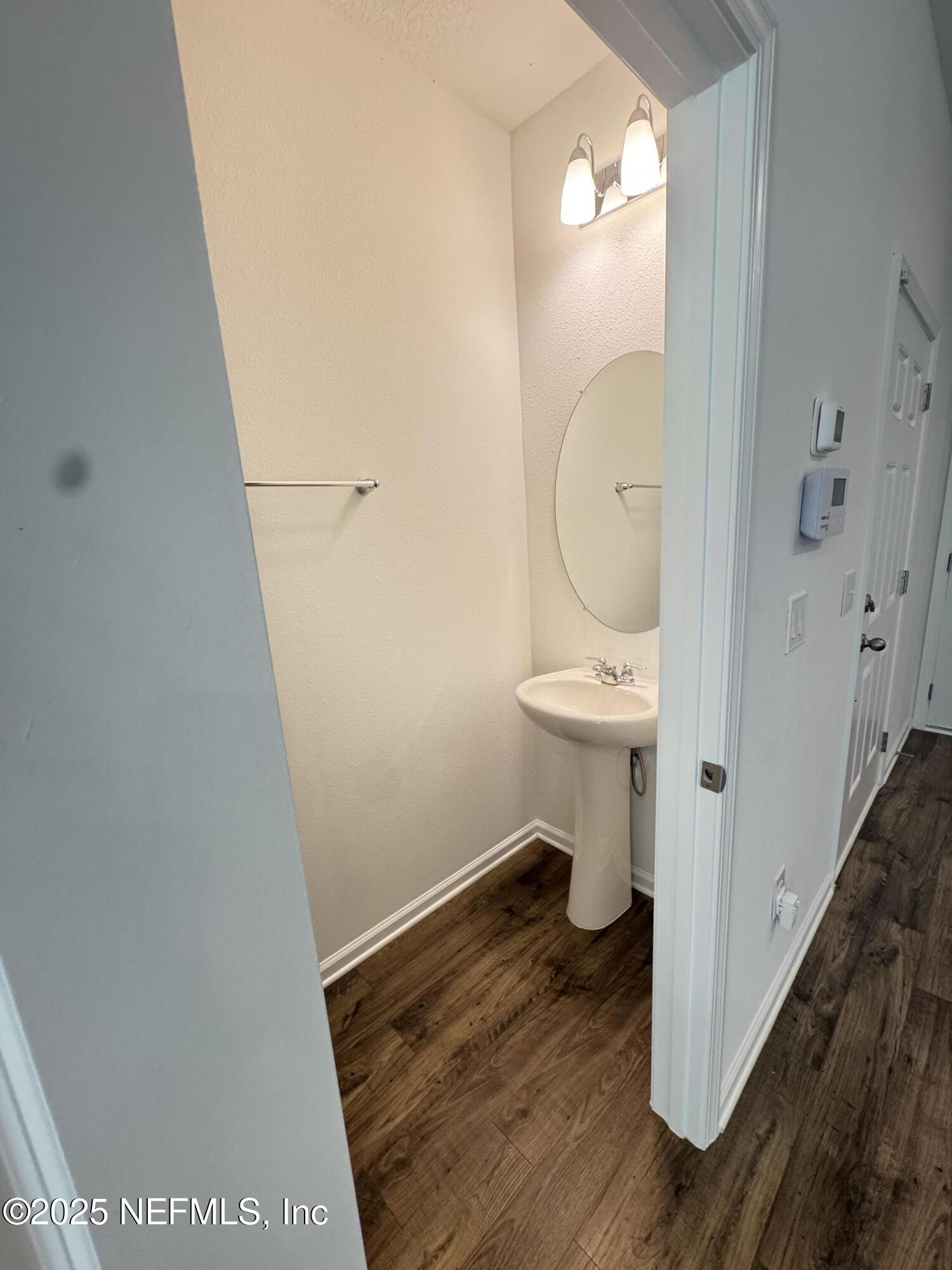 13505 Ute Jacksonville, FL 32218 - Photo 30 of 34 a bathroom with a sink and a mirror