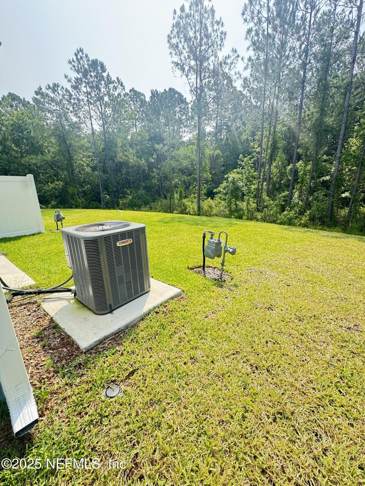 13505 Ute Jacksonville, FL 32218 - Photo 8 of 34 a view of a swimming pool with a yard and large trees
