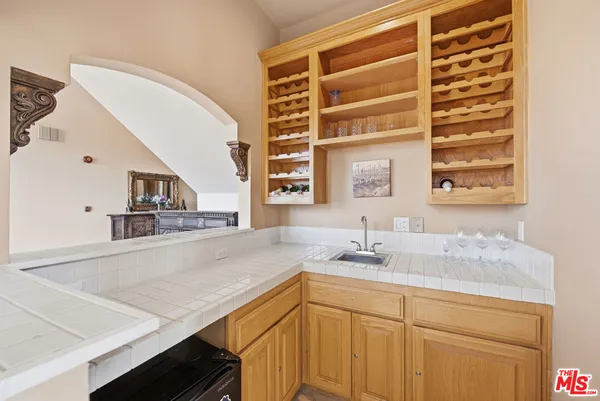 a bathroom with a sink a vanity and a mirror