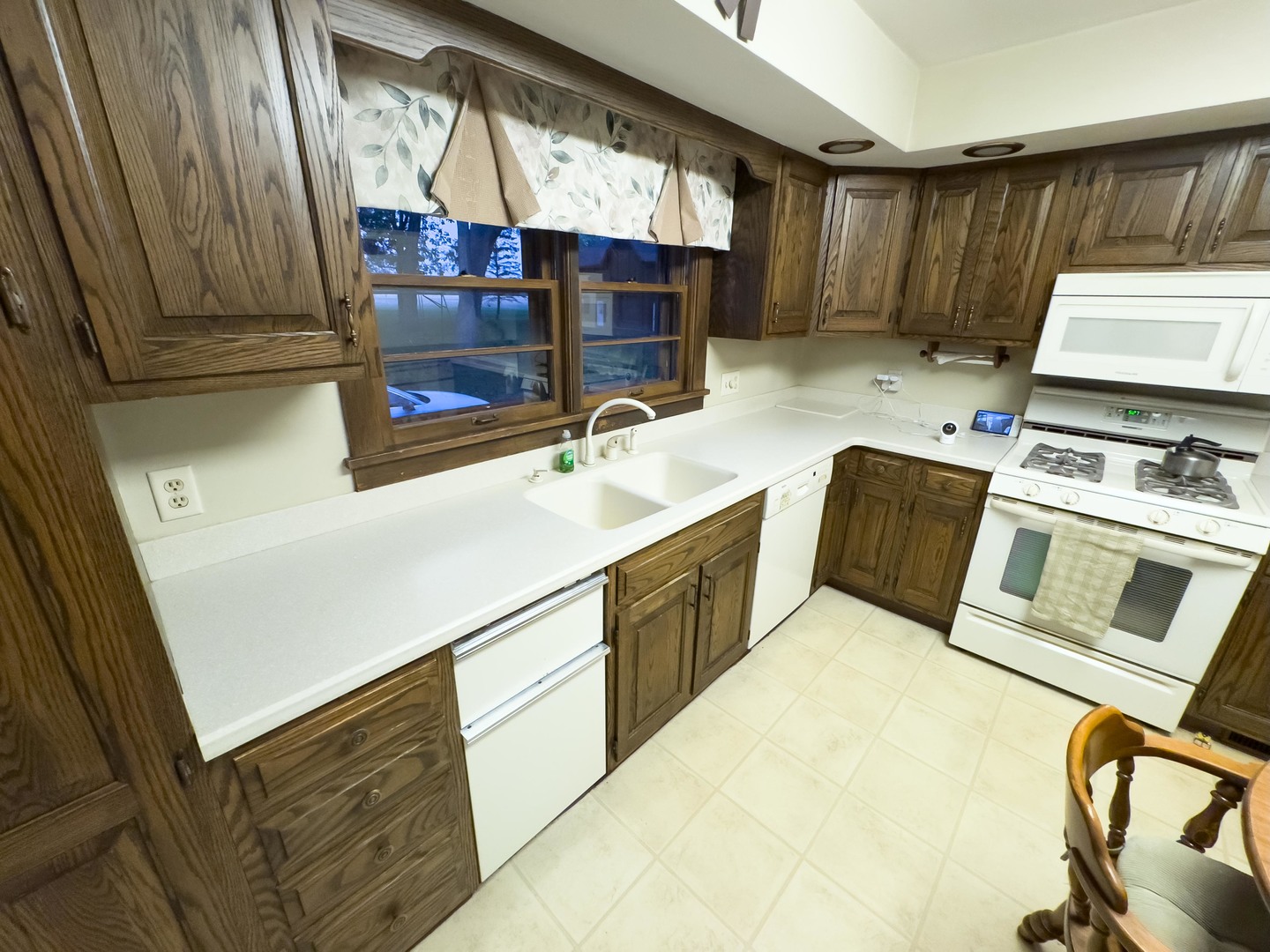 19256 1330 E Road Pontiac, IL 61764 - Photo 17 of 36 a kitchen with a sink appliances and cabinets