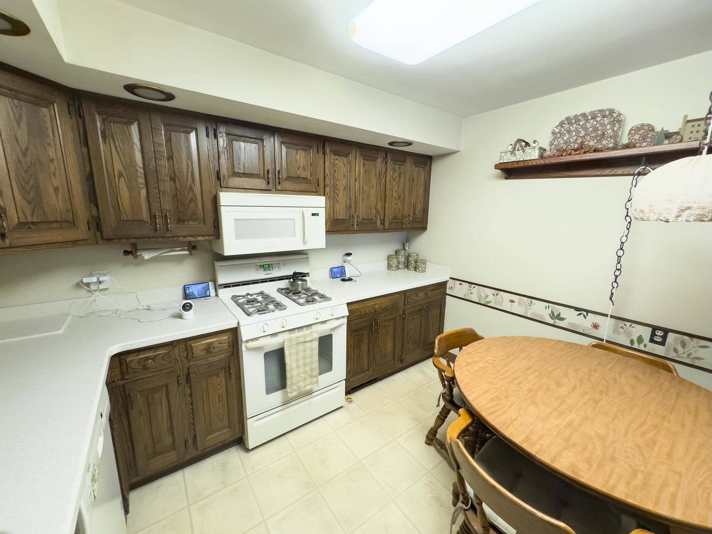 19256 1330 E Road Pontiac, IL 61764 - Photo 19 of 36 a kitchen with a stove a sink and a cabinets